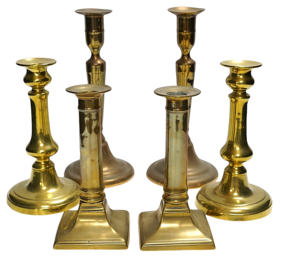 Three pairs of brass candlesticks, tallest 24cm. Condition - fair to good